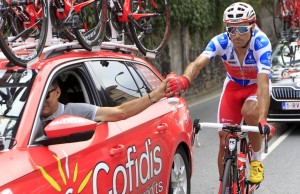 What sanctions and fines can be imposed on cyclists during a race?