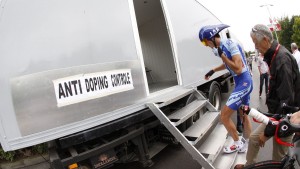 What sanctions and fines can be imposed on cyclists during a race?