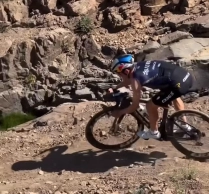 Pidcock being Pidcock: sleeveless jersey, short socks, and testing his new Pinarello Dogma F on the mountain