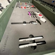 Un caja de herramientas con dos medallas de oro